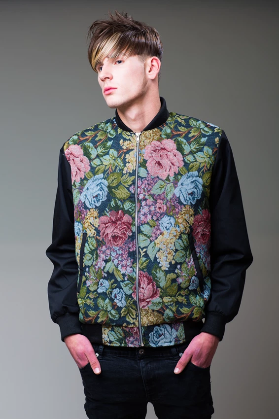 Studio lifestyle photo of man in floral print jacket